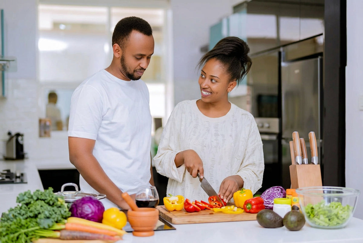 Couple cooking together in a Kigali kitchen with Abby Home cookware
